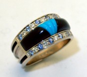 RB 3 Blue Sapphire, Diamond, Black jade, and Turquoise set into 14 kt white gold.